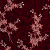 Lynette Sham | Poppy | A close up of embroidered silk velvet fabric in poppy, a warm coral pink.