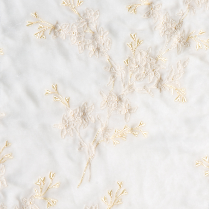 Lynette Sham | Winter White | A close up of embroidered silk velvet fabric in winter white, softer and warmer in tone than classic white.