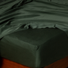 Madera Luxe Fitted Sheet | Juniper | tencel™ fitted sheet on a mattress with a matching flat sheet.