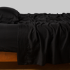 Madera Luxe Pillowcase (Single) | Corvino | sleeping pillow with matching rumpled sheeting - side view.