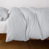 Madera Luxe Twin Duvet Cover | Cloud | duvet cover with matching sleeping pillow and fitted sheet - side view.