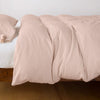 Madera Luxe Twin Duvet Cover | Rouge | duvet cover with matching sleeping pillow and fitted sheet - side view.