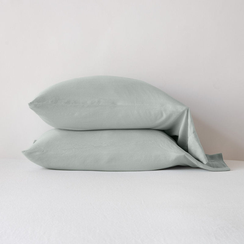 Madera Luxe Standard Pillowcase (Single) | Eucalyptus | Madera Luxe sleeping pillows in eucalyptus, stacked neatly against a white backdrop - side view.