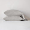 Madera Luxe Pillowcase (Single) | Fog | sleeping pillows stacked neatly against a white backdrop - side view.