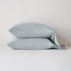 Madera Luxe Standard Pillowcase (Single) | Mineral | sleeping pillows stacked neatly against a white backdrop - side view.