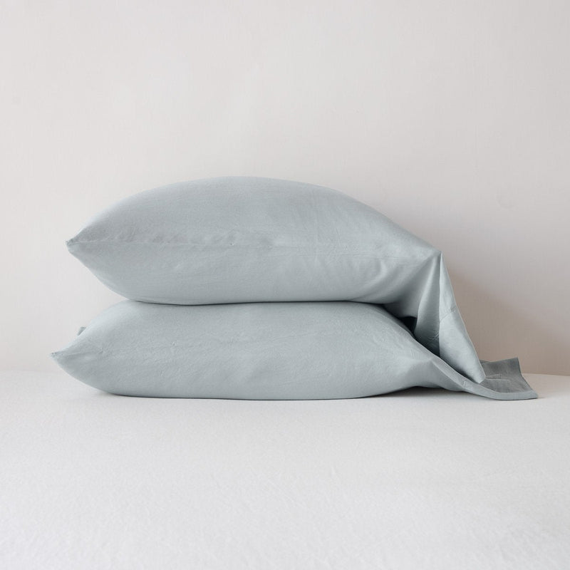 Madera Luxe Pillowcase (Single) | Mineral | sleeping pillows stacked neatly against a white backdrop - side view.