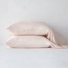 Madera Luxe Pillowcase (Single) | Pearl | sleeping pillows stacked neatly against a white backdrop - side view.