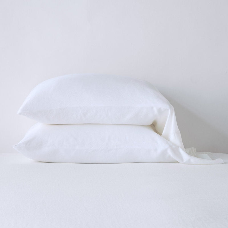 Madera Luxe Pillowcase (Single) | White | sleeping pillows stacked neatly against a white backdrop - side view.