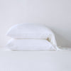 Madera Luxe Standard Pillowcase (Single) | White | sleeping pillows stacked neatly against a white backdrop - side view.