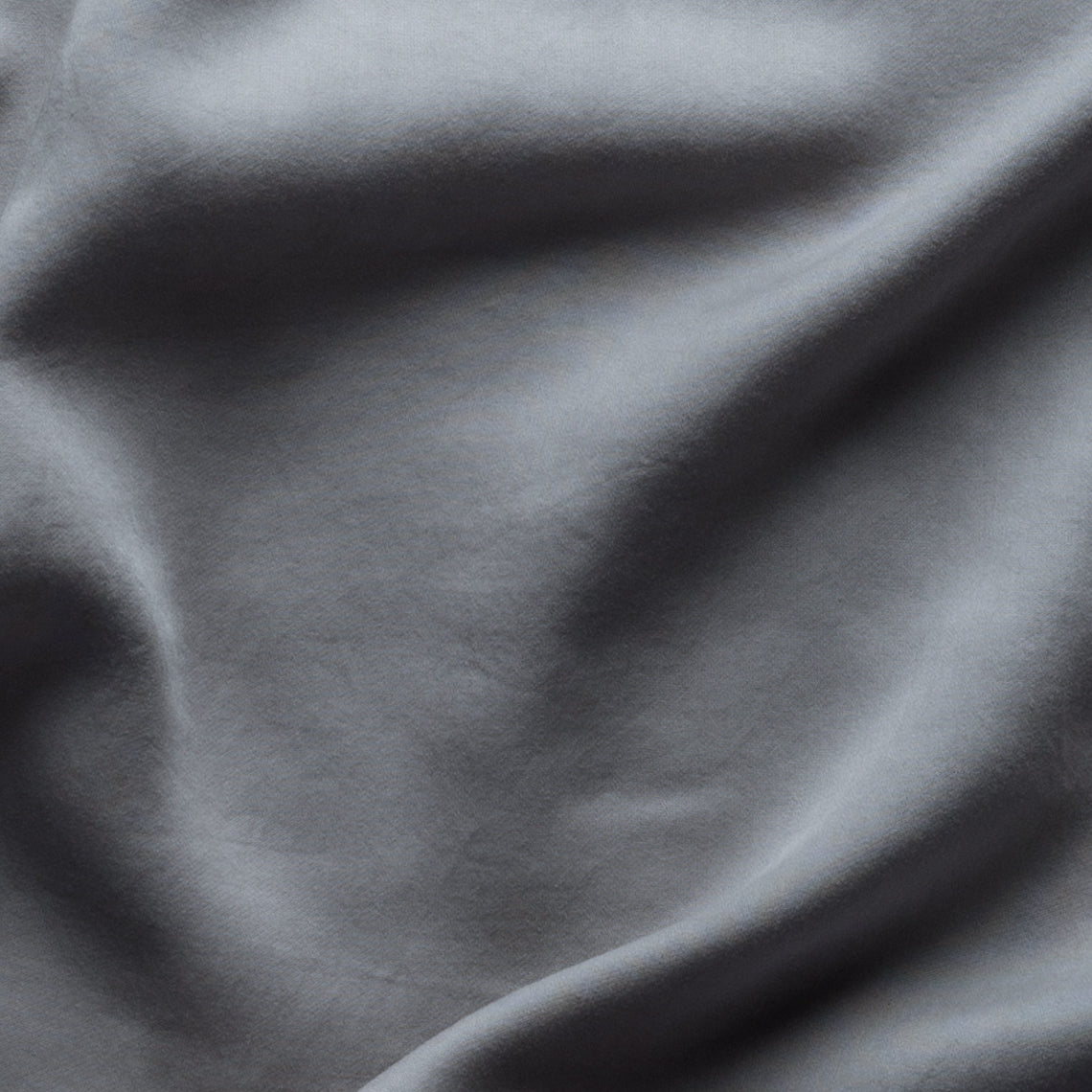Moonlight: close up of tencel fabric, slightly rumpled. 