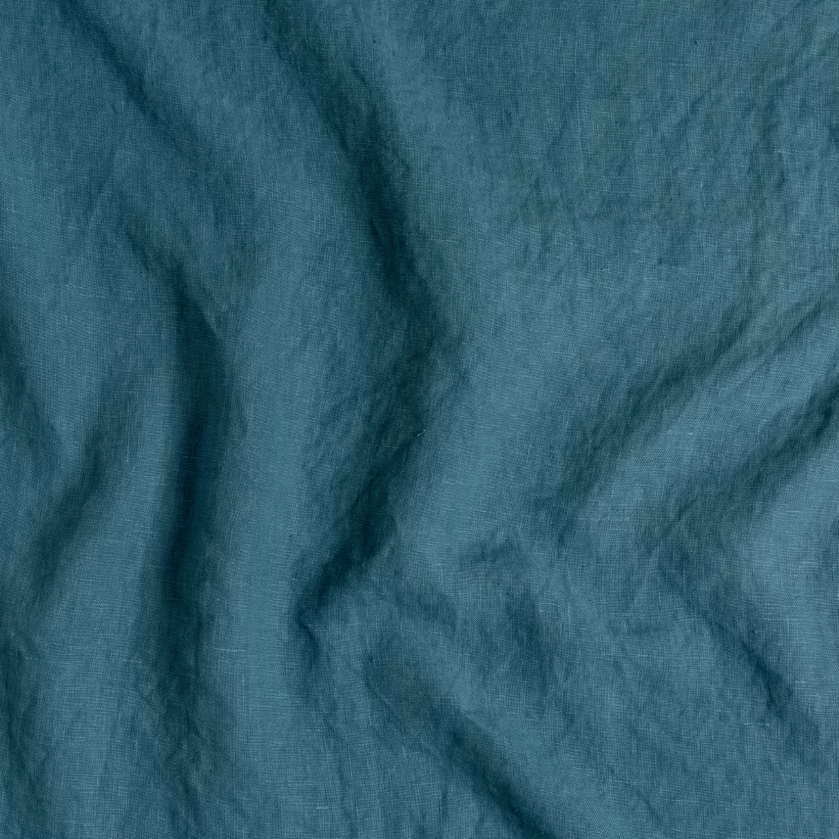 Austin Sham | Cenote | A close up of midweight linen fabric in cenote, a vibrant, ocean-inspired blue-green.