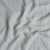 Midweight Linen Swatch | Cloud | A close up of midweight linen fabric in cloud, a soft, subtle sky blue-grey.