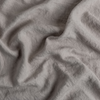 Austin Bed Skirt | Fog | A close up of midweight linen fabric in fog, a neutral-warm, soft mid-tone grey.
