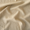 Austin Bed Skirt | Honeycomb | A close up of midweight linen fabric in honeycomb, a warm golden tone.