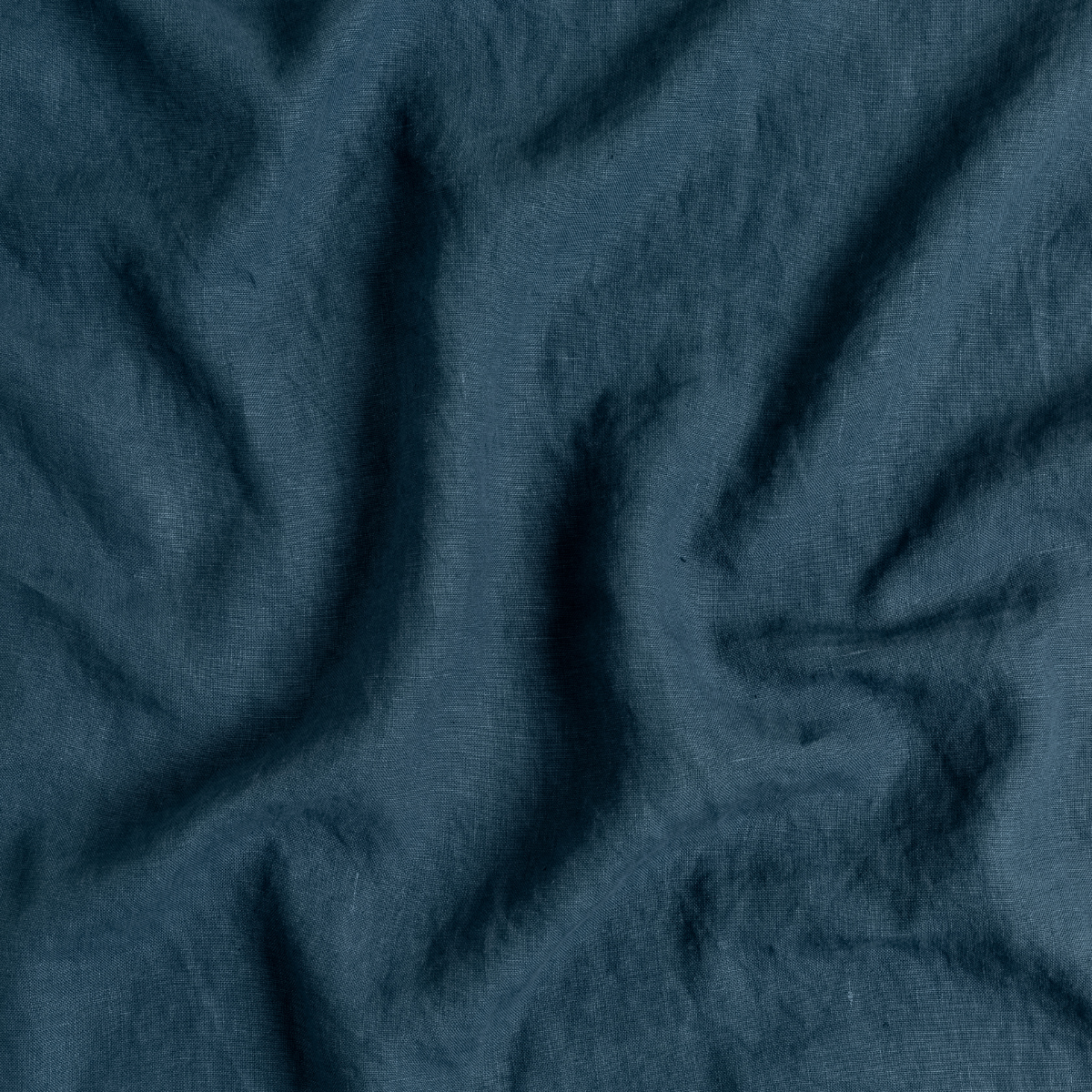 Austin Bed Skirt | Midnight | A close up of midweight linen fabric in midnight, a rich indigo tone.