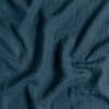 Austin Throw Pillow | Midnight | A close up of midweight linen fabric in midnight, a rich indigo tone.