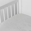 Mirabella Crib Sheet — Limited Release | Cloud | a silk and tencel™ crib sheet shown slightly overhread and shot into the corner of a white crib.
