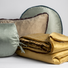 Paloma Blanket | throw pillows and blanket from the paloma collection shown against a white background.