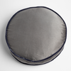 Paloma Throw Pillow | French Lavender | charmeuse 18" diameter round pillow trimmed with silk velvet shot from slightly overhead against a white background.