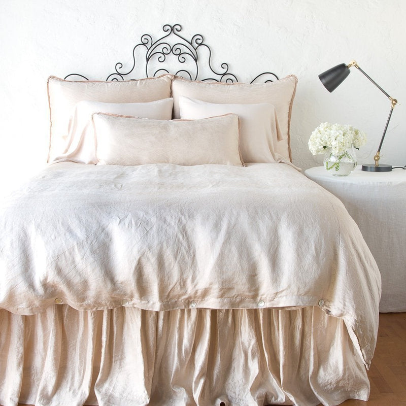 Pearl | Paloma bed skirt with matching duvet, and pillows - pearl, end of bed view.
