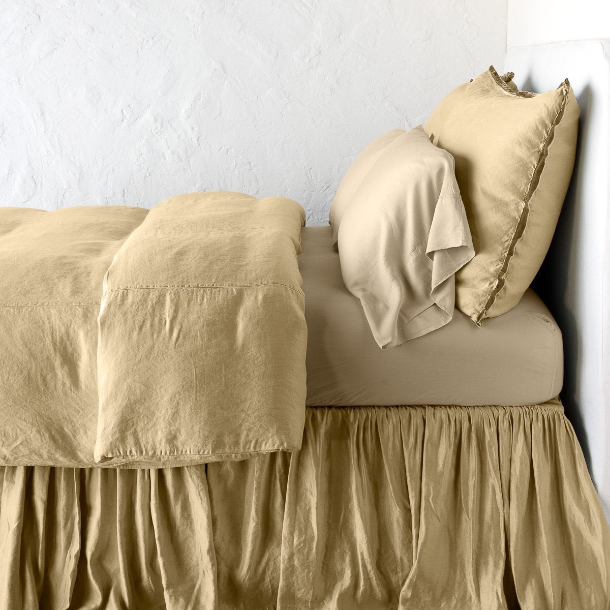 Paloma Duvet Cover | Honeycomb | duvet cover with matching pillows and bed skirt - side view.