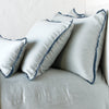 Paloma shams and lumbar pillow on a matching duvet cover - mineral, cropped side view.