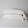Seraphina Pillowcase (Single) | White | sleeping pillows, stacked flat against a white background - side view.