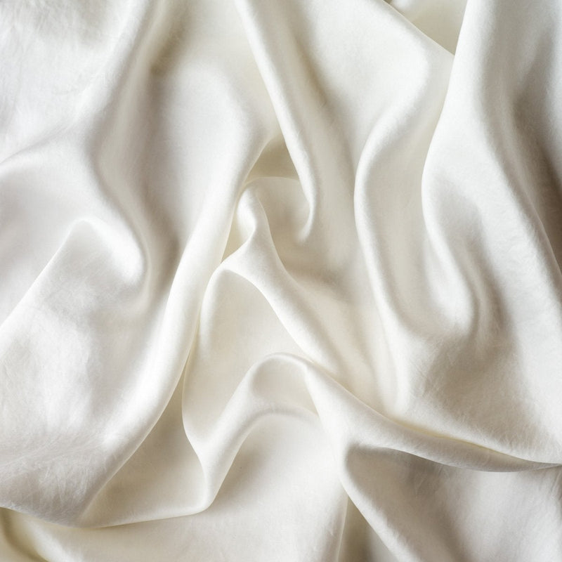 Seraphina Pillowcase (Single) | Winter White | A close up of our silk-Tencel™ blend, in winter white, softer and warmer in tone than classic white.