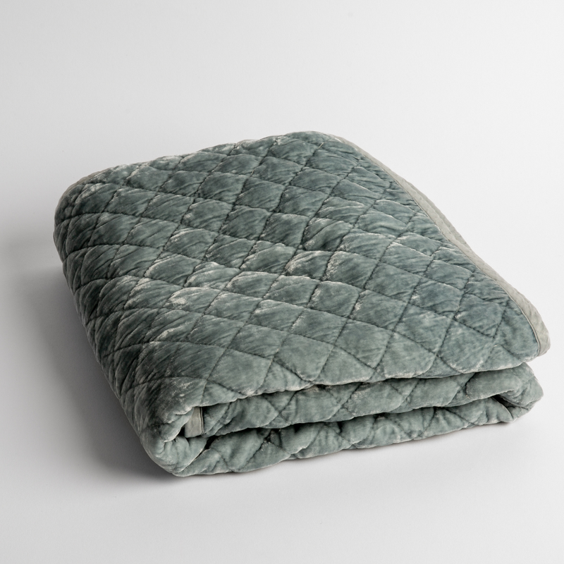 Silk Velvet Quilted Baby Blanket | Cloud | a folded quilted silk velvet baby blanket shown from overhead to showcase quilting  pattern and texture.