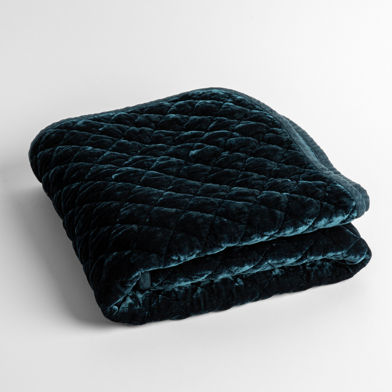 Silk Velvet Quilted Baby Blanket | Midnight | a folded quilted silk velvet baby blanket shown from overhead to showcase quilting  pattern and texture.