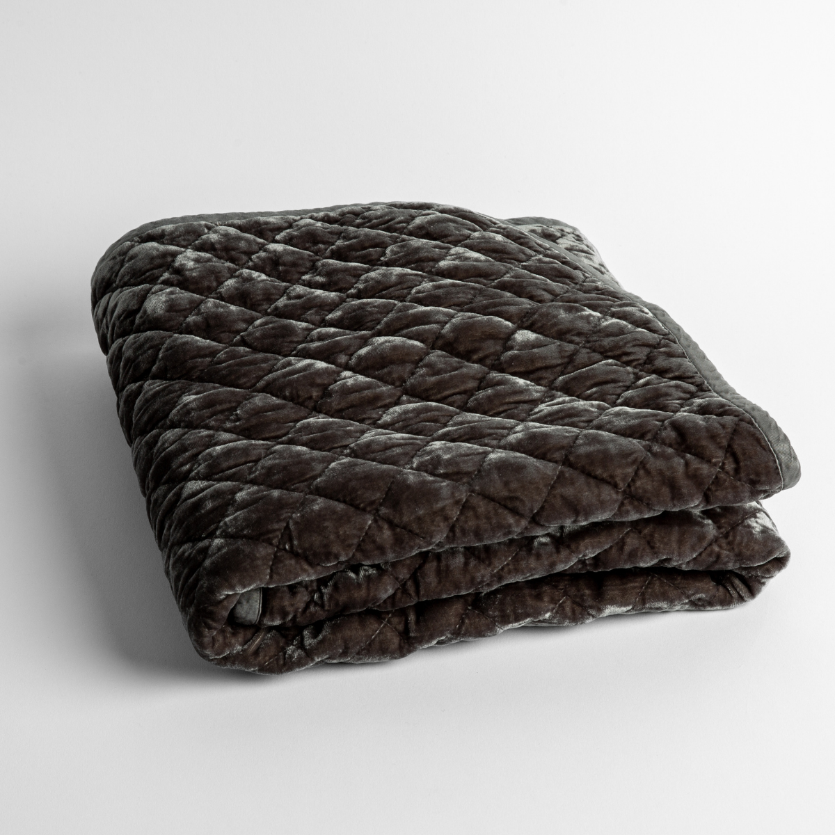 Silk Velvet Quilted Baby Blanket | Moonlight | a folded quilted silk velvet baby blanket shown from overhead to showcase quilting  pattern and texture.