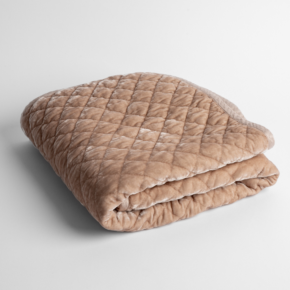 Silk Velvet Quilted Baby Blanket | Pearl | a folded quilted silk velvet baby blanket shown from overhead to showcase quilting  pattern and texture.