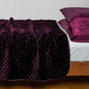 Silk Velvet Quilted Coverlet | Fig | coverlet with white sheeting - side view.