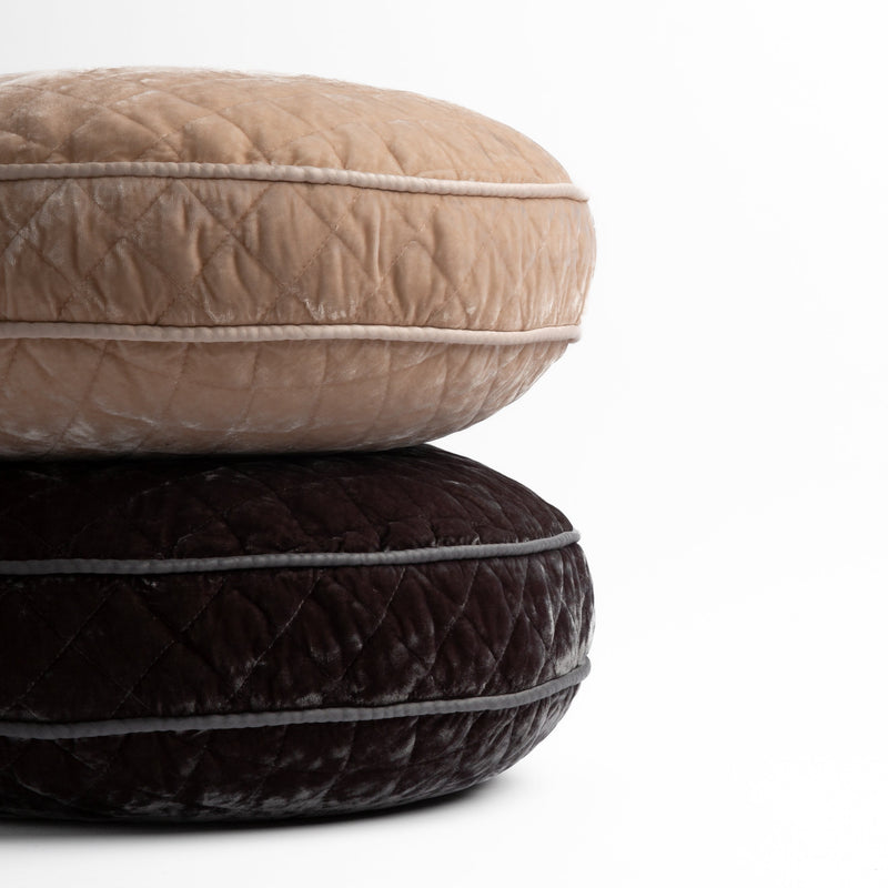 Silk Velvet Quilted Throw Pillow | two 18" round pillows stacked and shot straight on against a white background, pillows shown in Pearl and Moonlight.