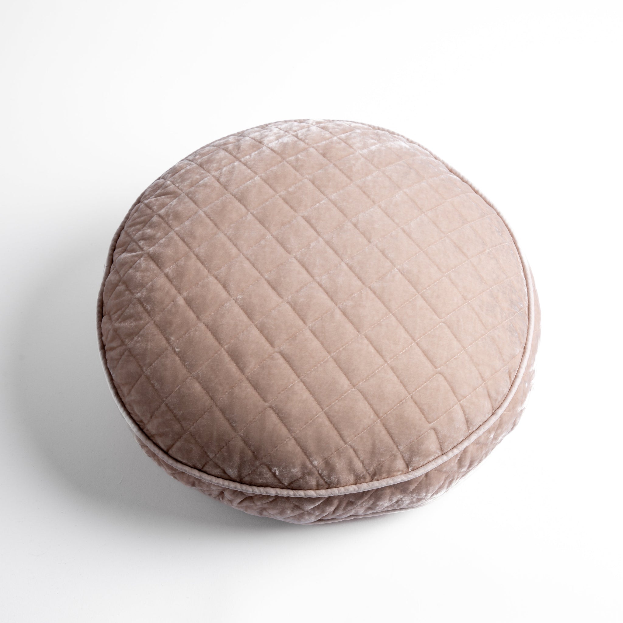 Silk Velvet Quilted Throw Pillow | Pearl | overhead at a slight angle against a white background, the face and gusset of the pillow are visible.