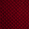 Silk Velvet Quilted Blanket | Poppy | Close-up of quilted silk velvet in poppy, a vibrant reddish pink.