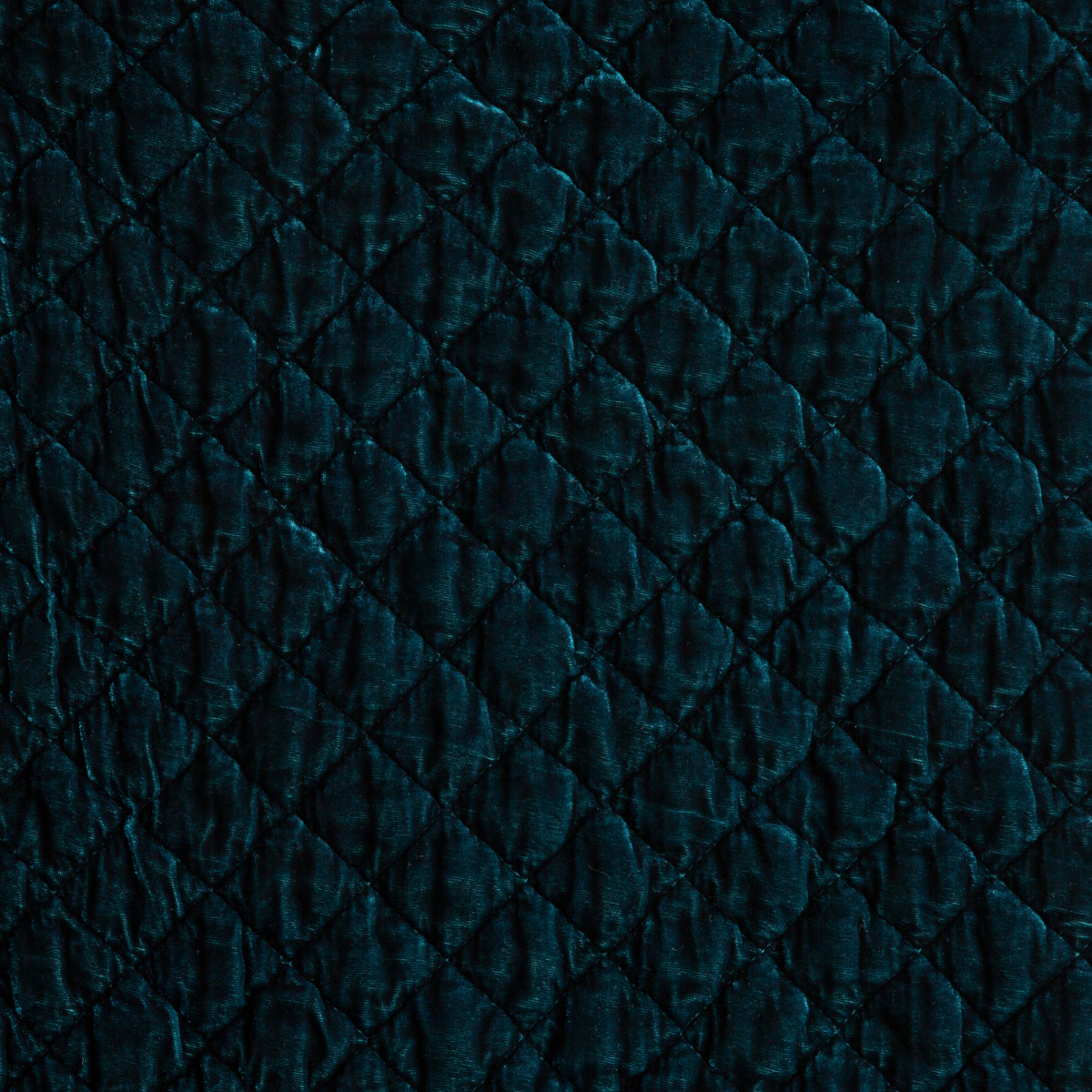 Silk Velvet Quilted Coverlet | Cenote | A close up of quilted silk velvet fabric in cenote, a vibrant, ocean-inspired blue-green.