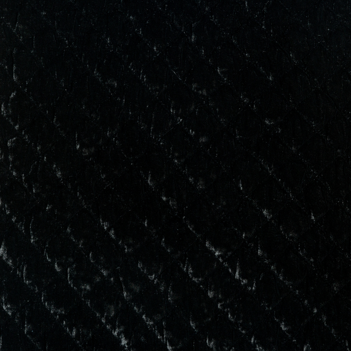Silk Velvet Quilted Coverlet | Corvino | A close up of quilted silk velvet fabric in Corvino, a black tone.
