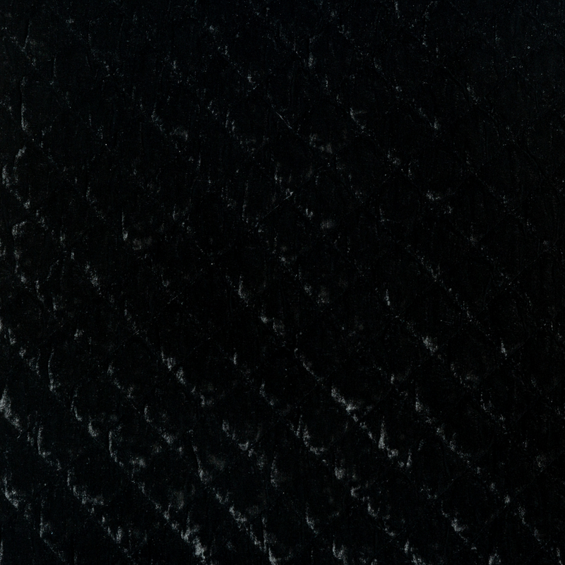Silk Velvet Quilted Throw Pillow | Corvino | A close up of quilted silk velvet fabric in Corvino, a black tone.