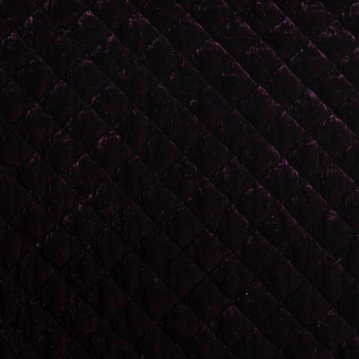 Silk Velvet Quilted Twin Coverlet | Fig | A close up of quilted silk velvet fabric in fig, a richly saturated purple-garnet.