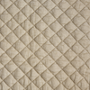 Silk Velvet Quilted Sham | Parchment | A close up of quilted silk velvet fabric in parchment, a warm, antiqued cream.