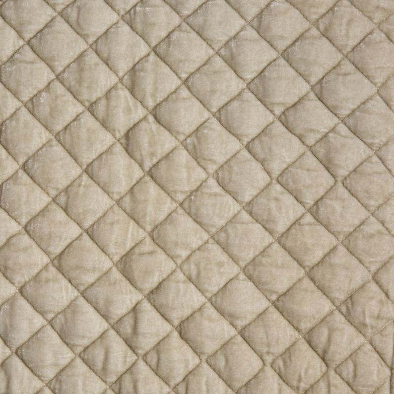 Silk Velvet Quilted Blanket | Parchment | A close up of quilted silk velvet fabric in parchment, a warm, antiqued cream.