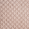 Silk Velvet Quilted Yardage | Pearl | A close up of quilted silk velvet fabric in pearl, a nude-like, soft rose pink tone.