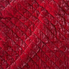 Silk Velvet Quilted Baby Blanket | Poppy | A close up of quilted silk velvet fabric in poppy, a warm coral pink.