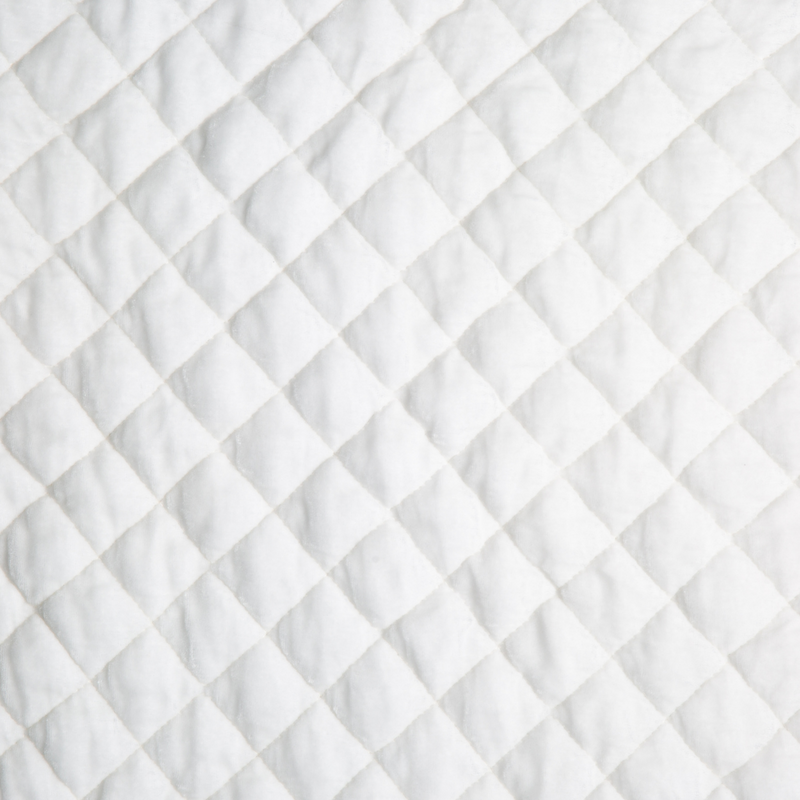 Silk Velvet Quilted Twin Coverlet | Winter White | A close up of quilted silk velvet fabric in winter white, softer and warmer in tone than classic white.