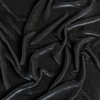 Loulah Blanket | Fog | A close up of silk velvet fabric in fog, a neutral-warm, soft mid-tone grey.