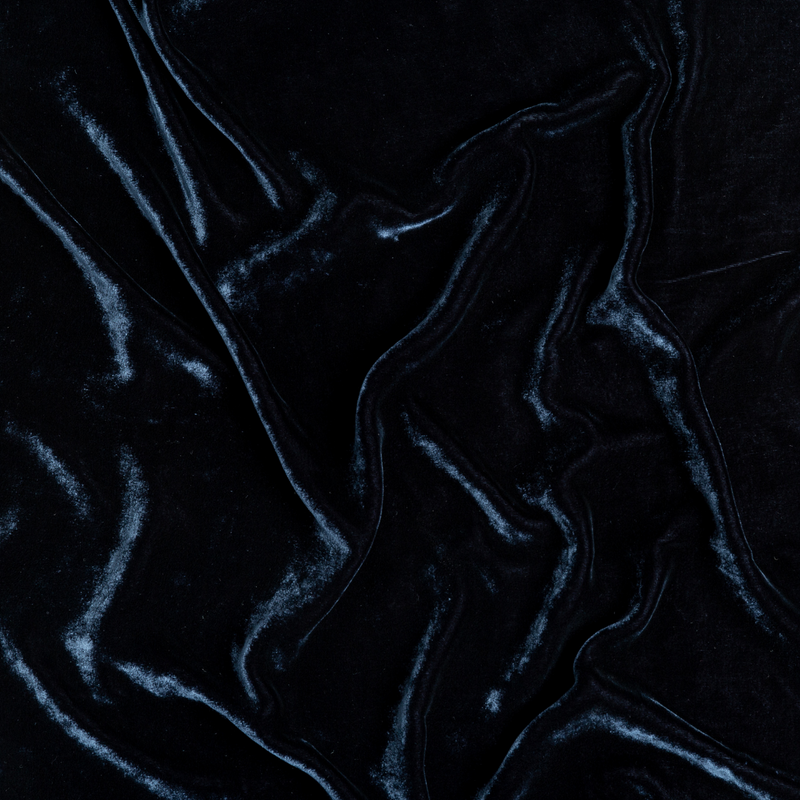 Carmen Blanket | Midnight | A close up of silk velvet fabric in midnight, a rich indigo tone.