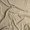 Carmen Blanket | Parchment | A close up of silk velvet fabric in parchment, a warm, antiqued cream.