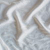 Silk Velvet Swatch | Winter White | A close up of silk velvet fabric in winter white, softer and warmer in tone than classic white.