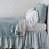 Silk Velvet Quilted Twin Coverlet | Cloud | coverlet with matching shams and white sheeting - side view.